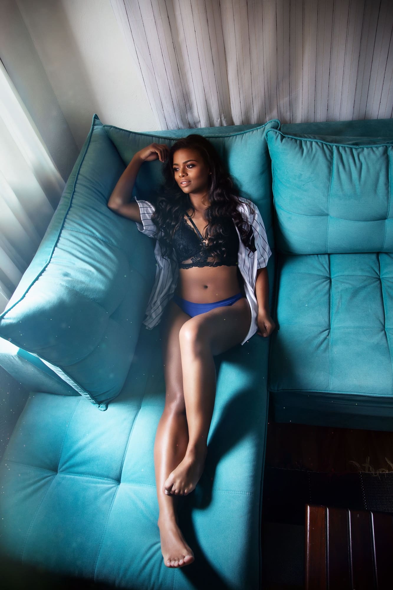 woman-in-lingerie-lying-on-blue-sofa.jpg